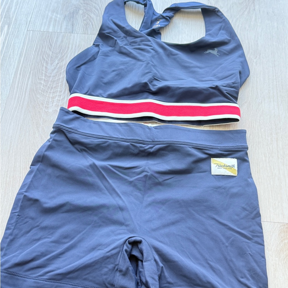 Tracksmith navy Blue bra with Red and White Accents and matching shorts